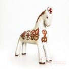 White horse with red ornament