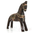 A bay horse with copper-green harness