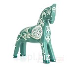 A copper patina colored horse with a round decorative element