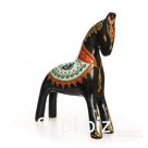 A black horse with a red and white pattern